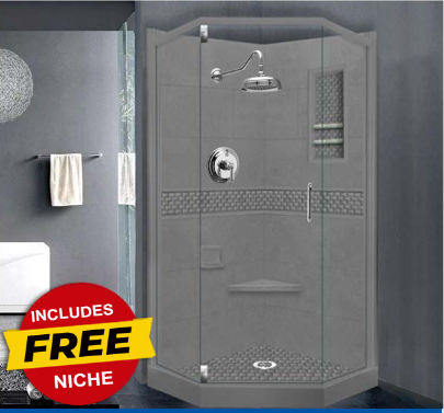 A finished neo-angle shower kit with a gray stone-like finish including a shampoo niche, with a clear glass door and a shower head, depicted in a bathroom setting.