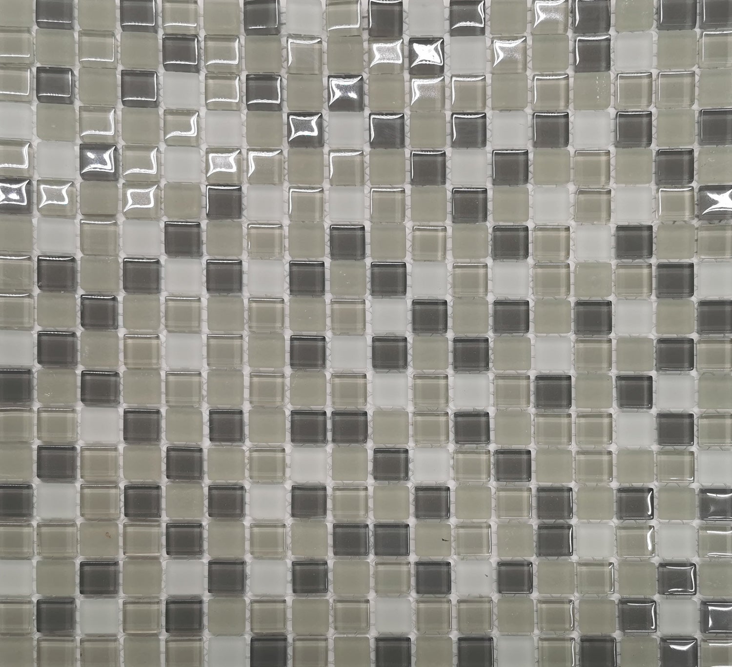 Pattern of small square tiles in various shades of gray called Delmar mosaic.
