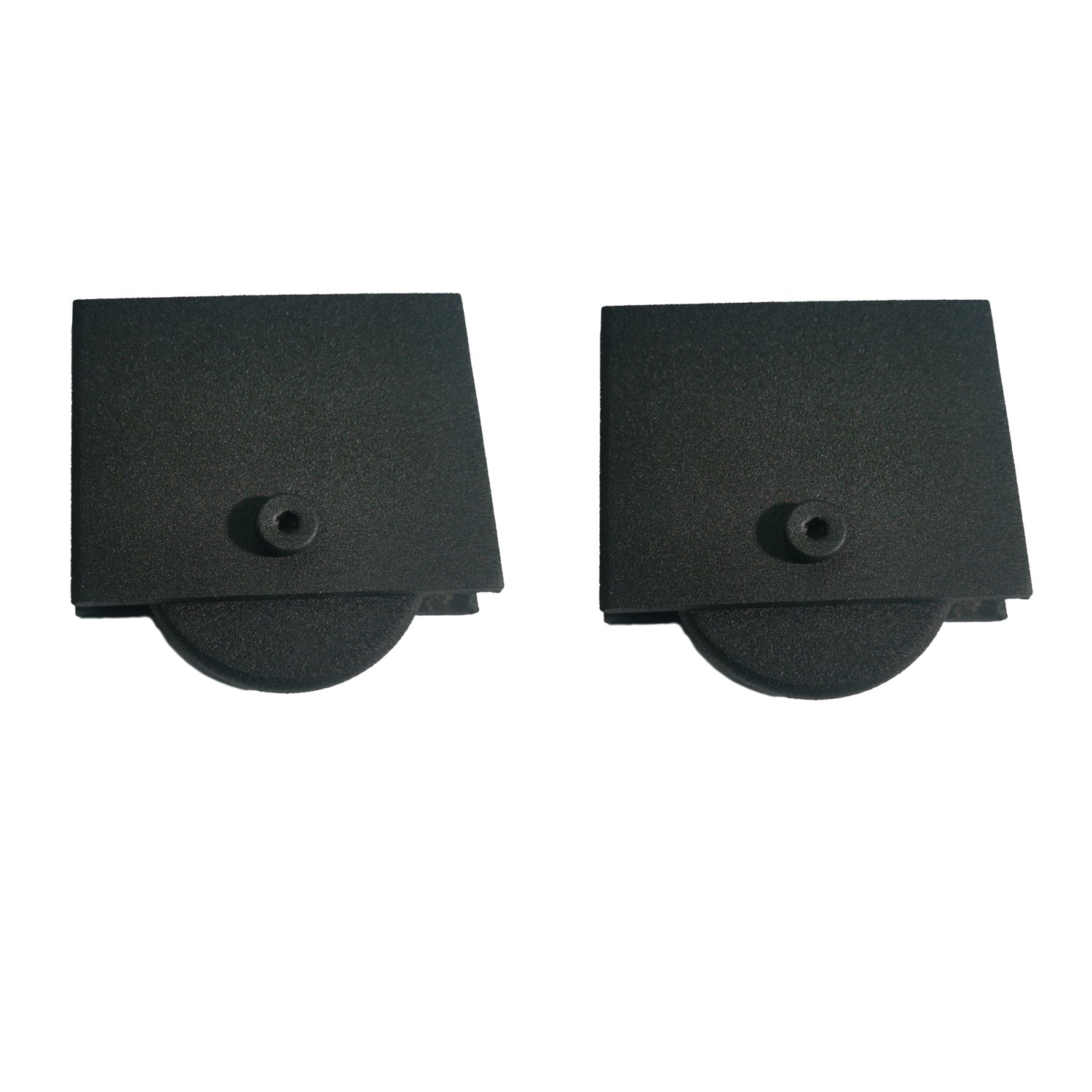Two black rectangular metal objects with metal wheels on a white background