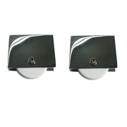 Two Chrome rectangular metal objects with metal wheels on a white 